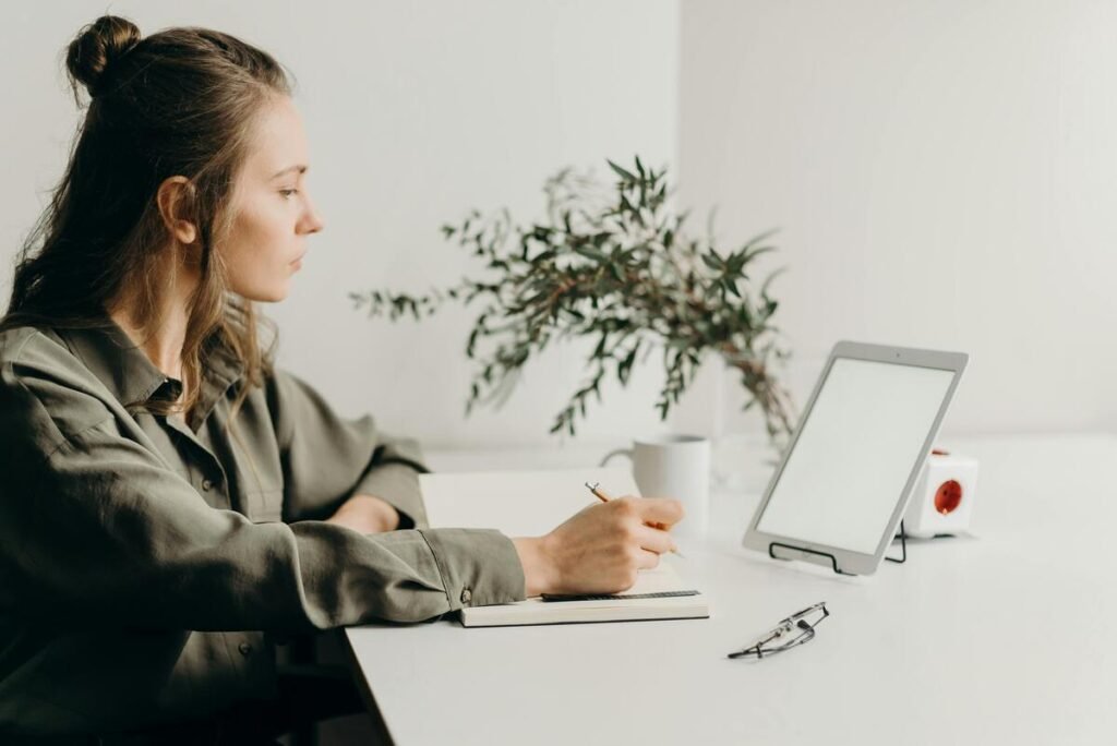 A woman writing down notes