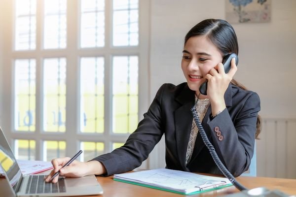 Woman responding to customer inquiries