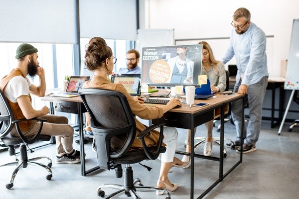 A team of web designers working at the office.