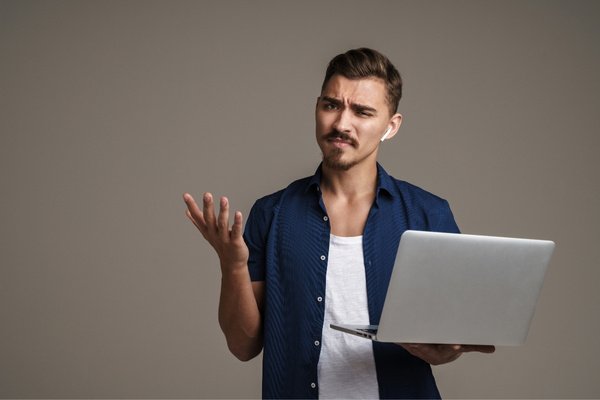 A man getting confused browsing a website.