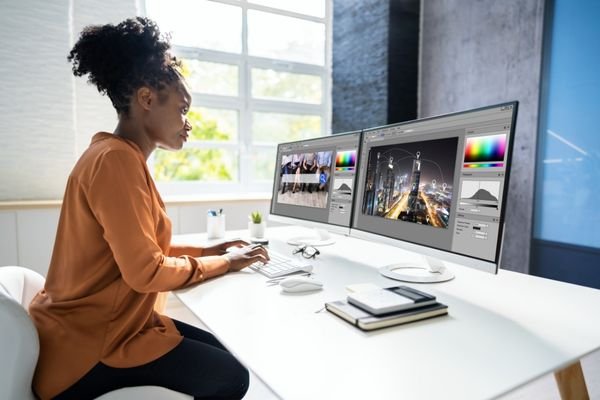 Woman trying different colors for website design