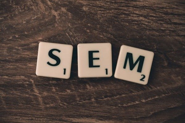 white SEM scrabble tiles on wood surface