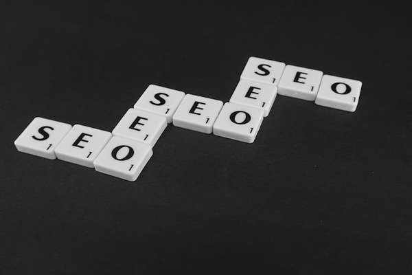 white scrabble SEO tiles on black surface