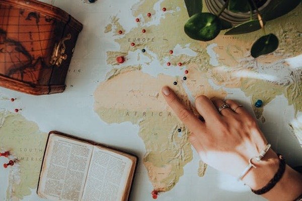 woman pointing at map