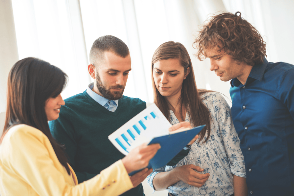 team reviewing check cashing performance reports
