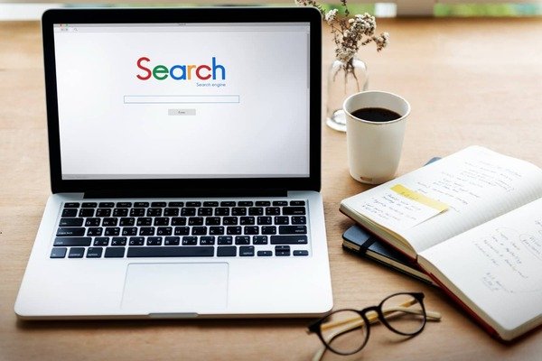 A laptop displaying the Google search engine