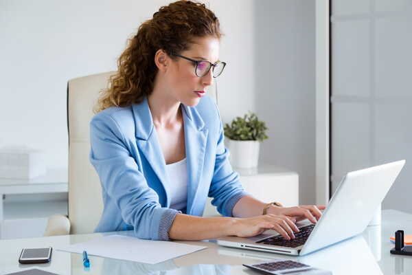 A businesswoman searching the Internet