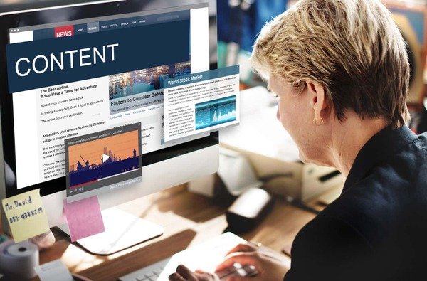A woman reading content on a website