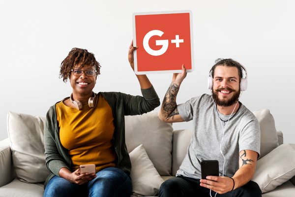A couple holding Google Plus