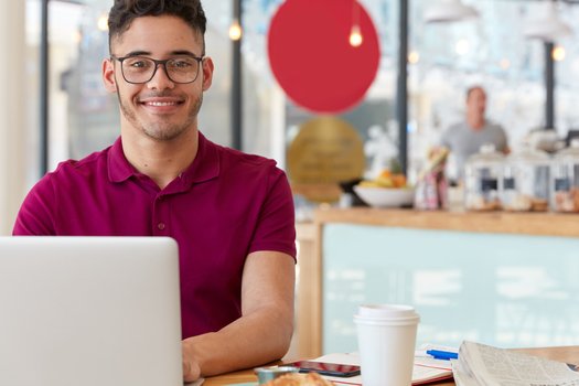 Office worker researching what is SEO marketing trends for 2025.