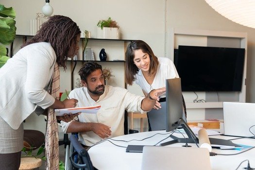 Team collaborating on SEO strategy showing what agencies do for client success.