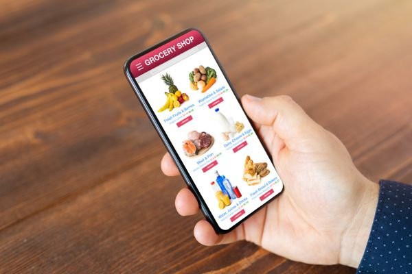A person shopping for products via mobile, highlighting mobile SEO.