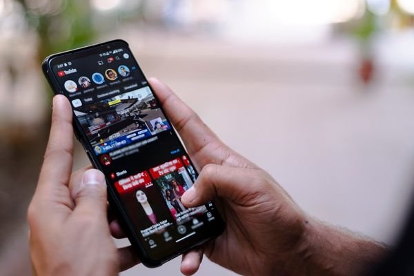 Man watching YouTube video with ads