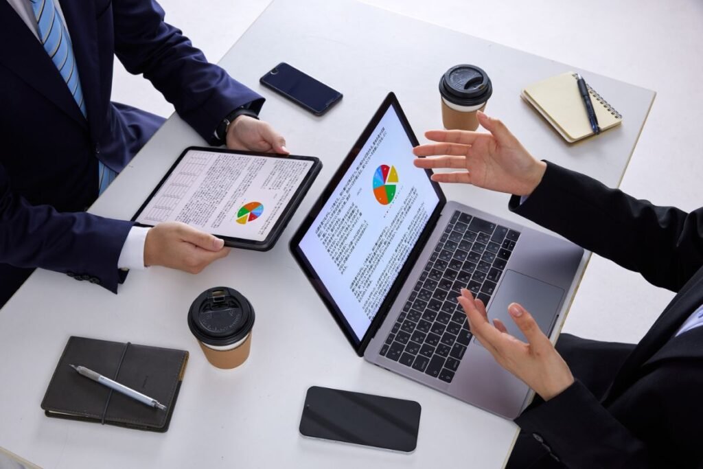 Marketing team reviewing Google Ads CPC data on a laptop.