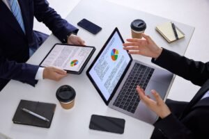 Marketing team reviewing Google Ads CPC data on a laptop.