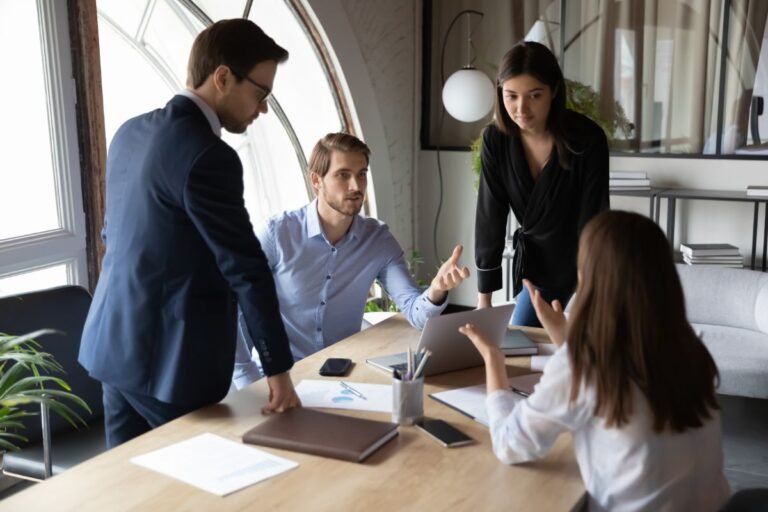 Team of professionals discussing SEO strategy.