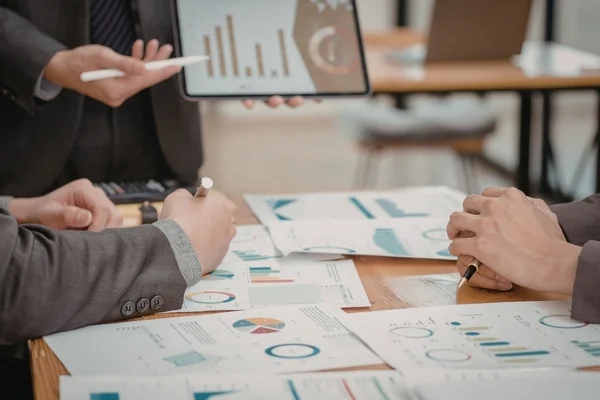 SEO team discussing performance data and trends.