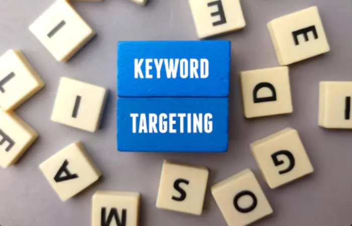 Blue keyword targeting blocks on letter tiles showing Shopify SEO strategy concepts.
