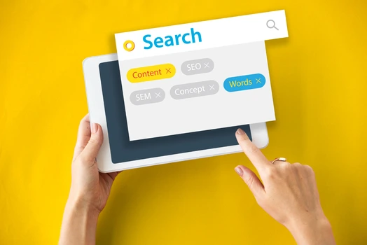 Hands using tablet with search interface demonstrating AI SEO content optimization features.