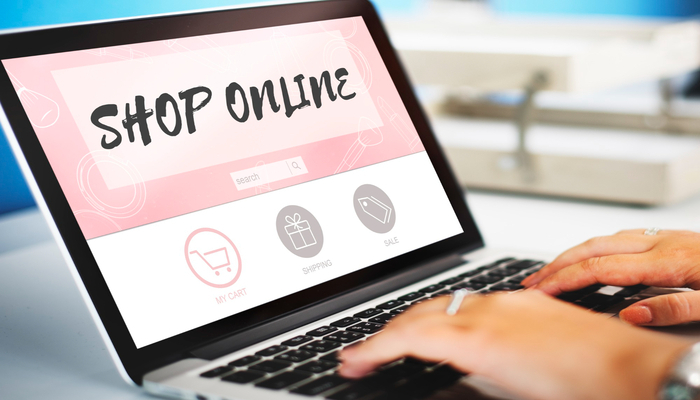 Person using a laptop showing a shop online page for Shopify SEO headers