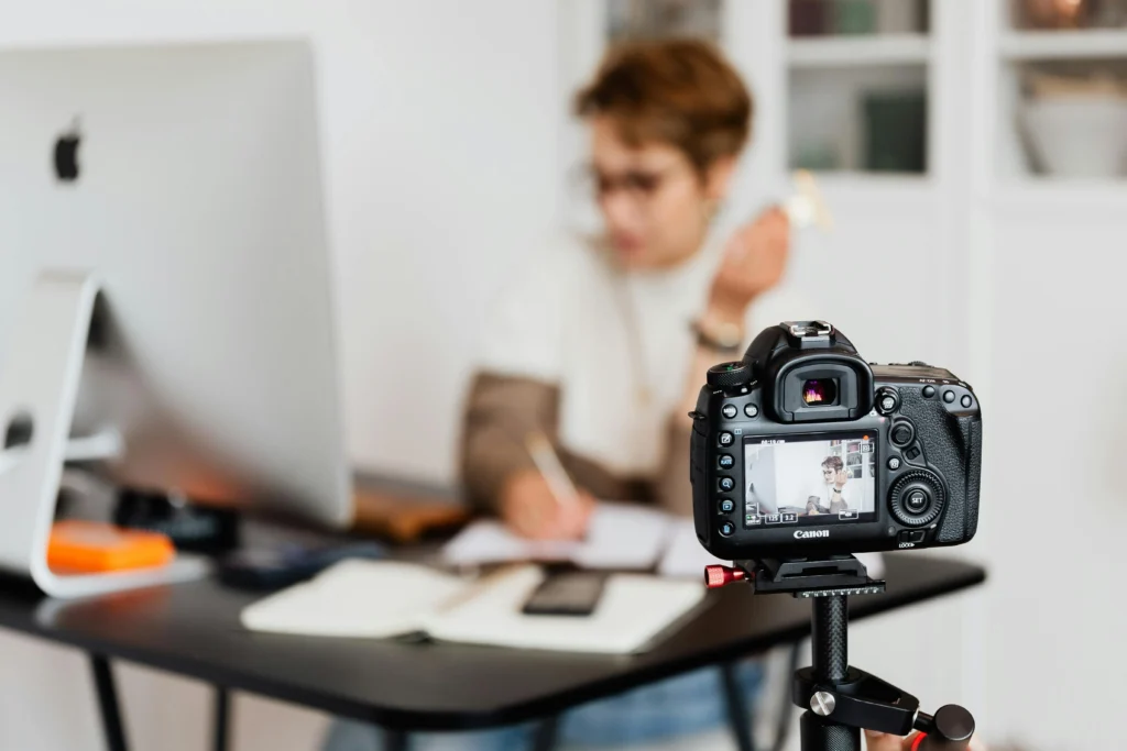 Content creator filming video while writing blog post for content marketing