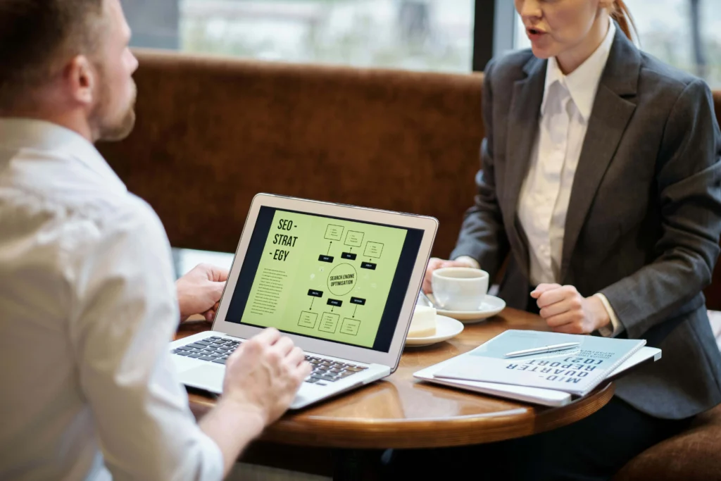 Meeting between two people discussing how much does SEO services cost