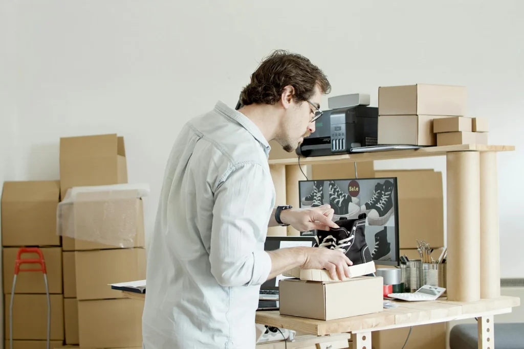 Business owner packing merchandise