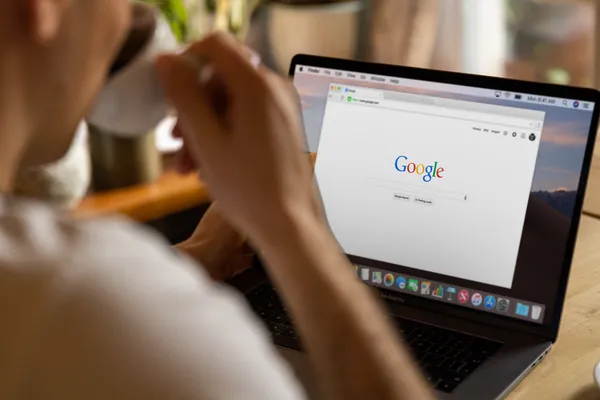 SEO specialist drinking coffee while searching on google 
