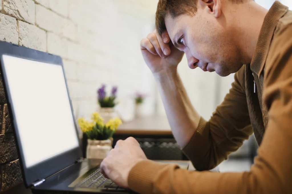 Is SEO Dead In 2026? What The Data Actually Shows 2 Frustrated business owner looking at his computer for SEO services