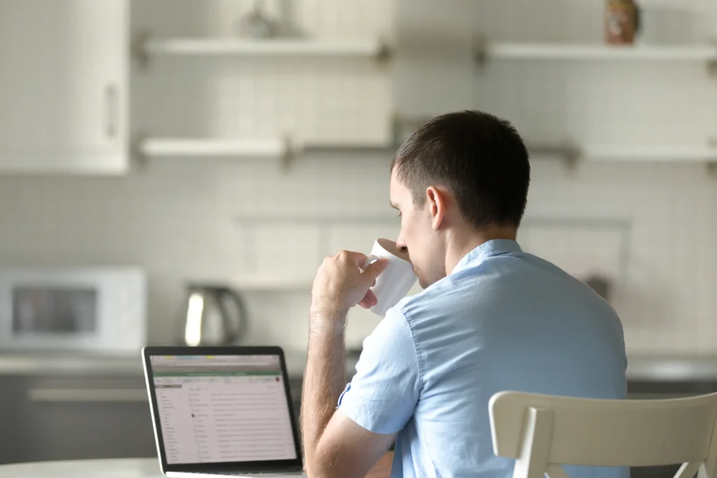 Man sitting looking at computer waiting at how long does SEO take