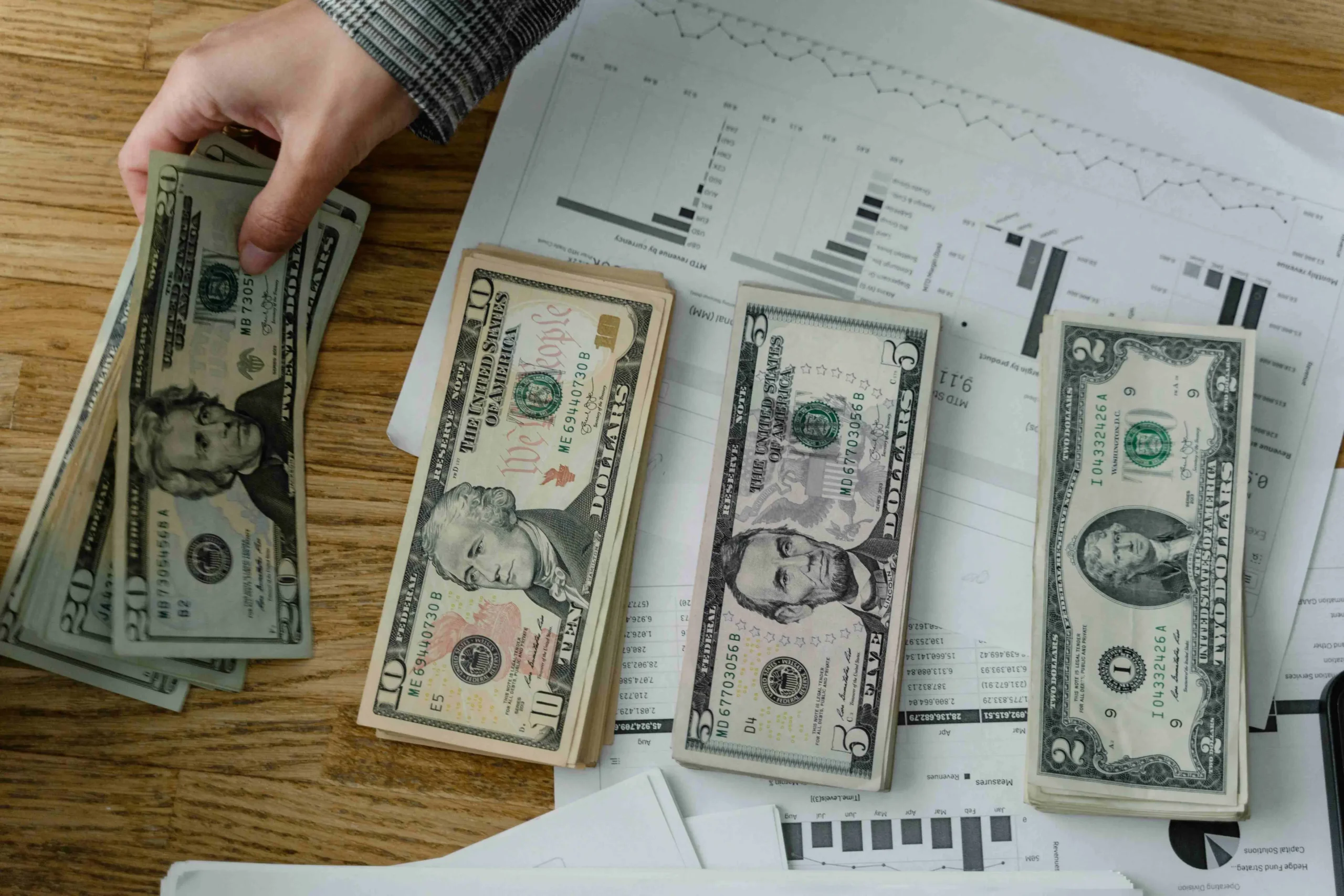 Stack of money for how much does SEO services cost