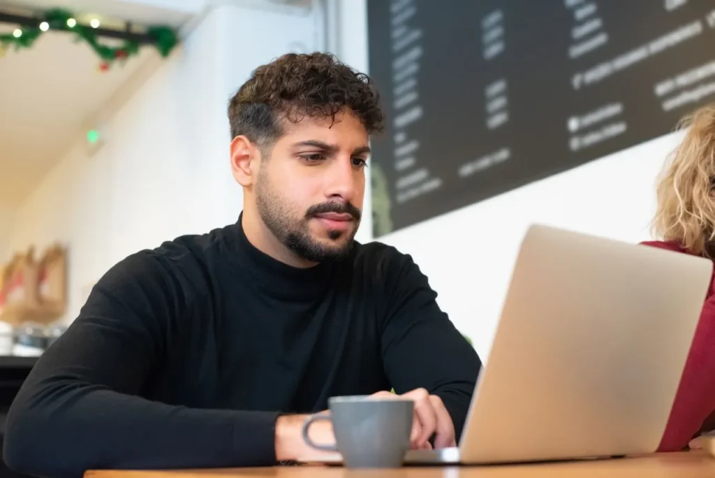 man working on his Google business profile suspension