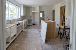 Kitchen mid-renovation shot from the doorway, the fixed angle used for before and after photos for remodelers