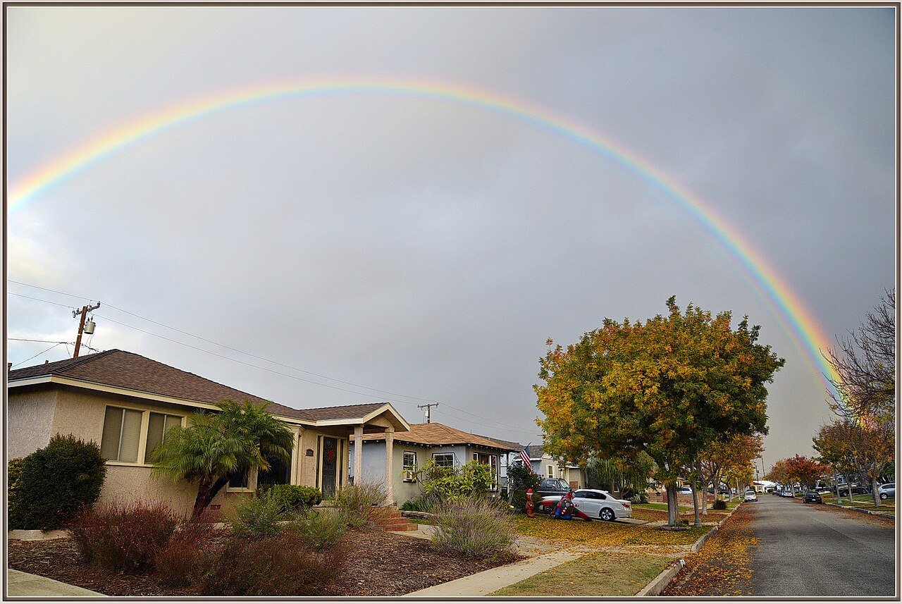 Rainbow over a street of ranch homes in Lakewood, California