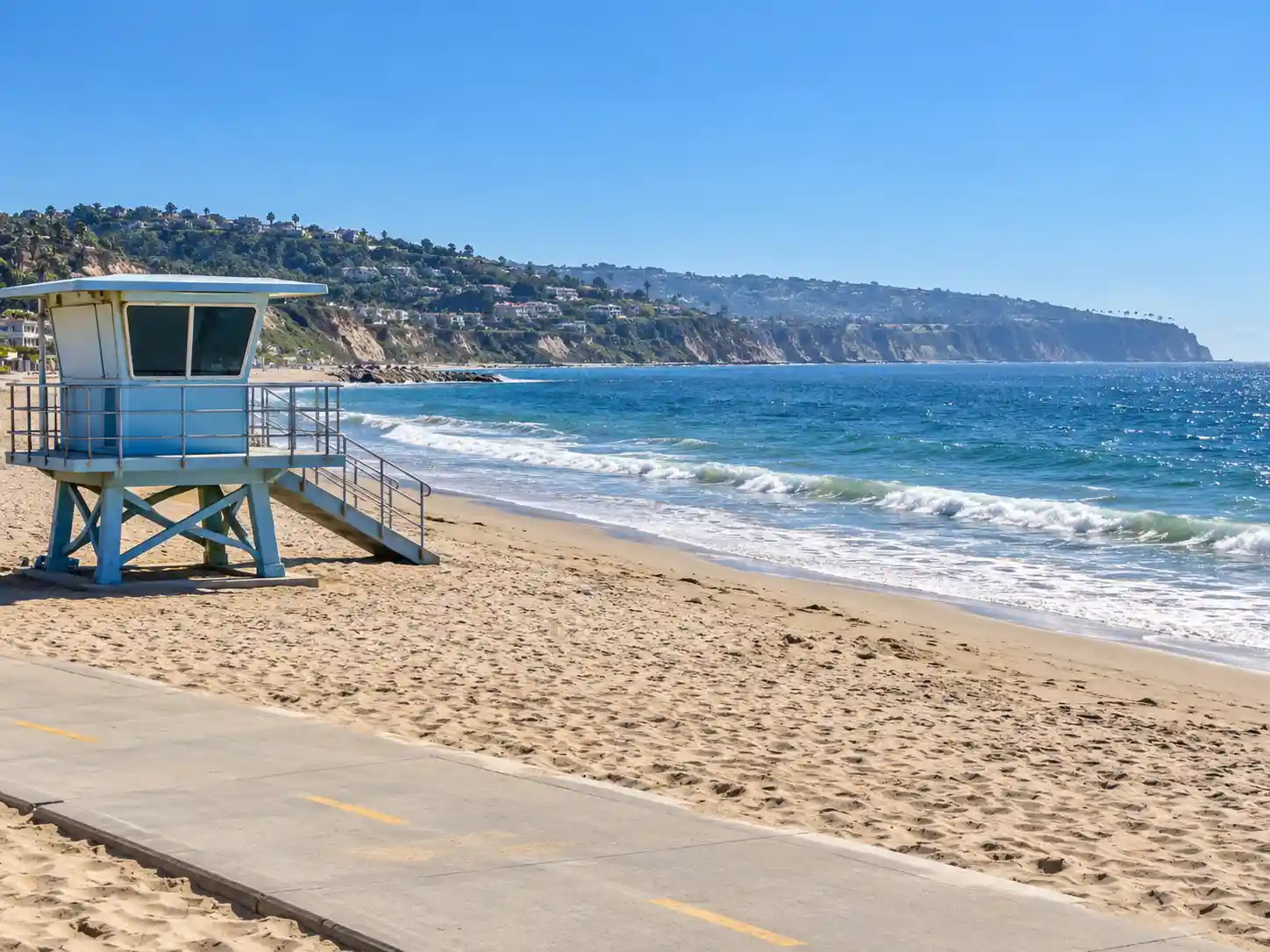 Lifeguard tower on Redondo Beach with the Palos Verdes Peninsula in the background