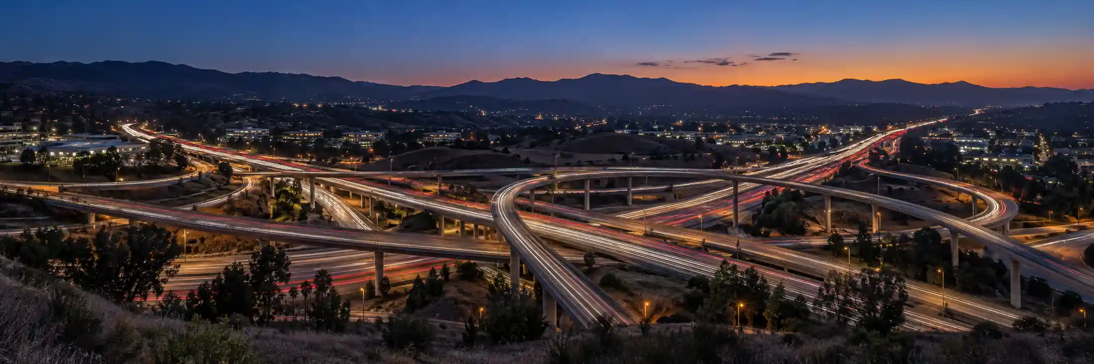 SR-57 and SR-60 freeway interchange in Diamond Bar, California at twilight
