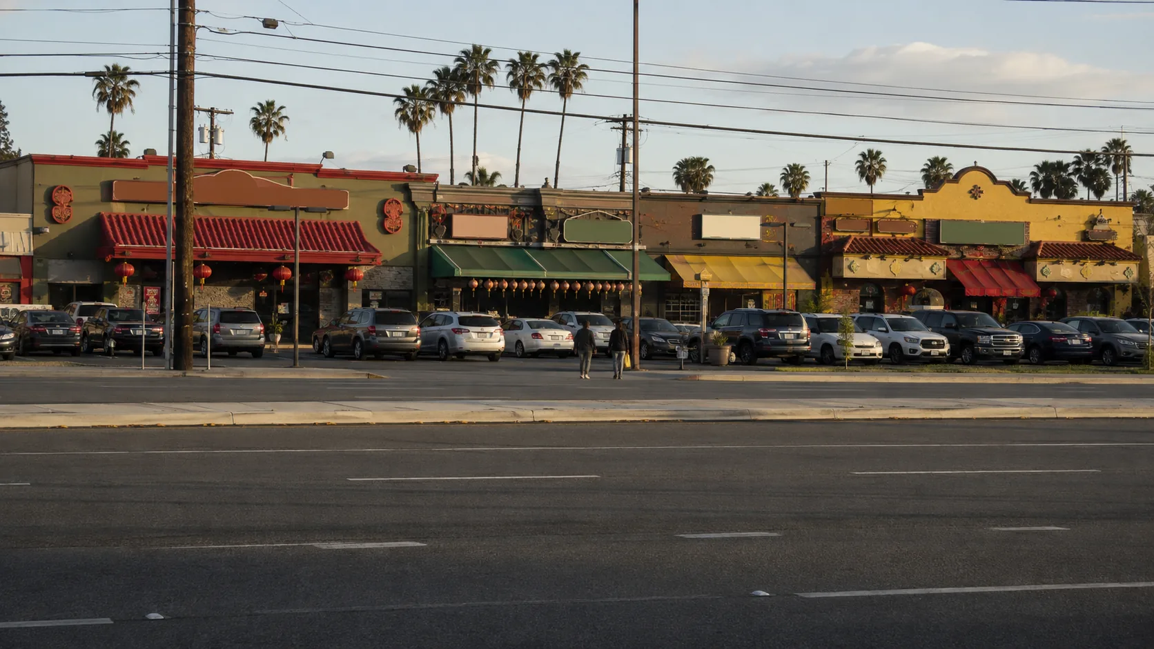 Small business storefronts along a commercial boulevard in Alhambra, CA