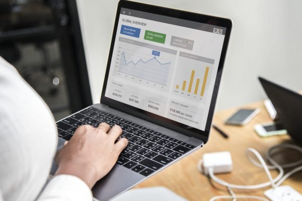 an seo specialist using a laptop to analyze data